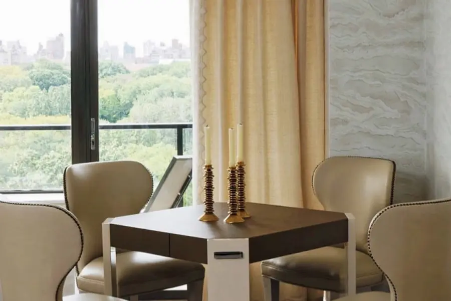 Elegant corner dining table featuring our custom Barclay Armless Dining Chairs.